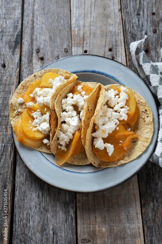 Mexican potato stew tacos with fresh cheese