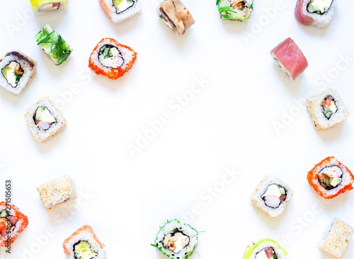 Different kinds of Sushi rolls frame on the white . Asian food concept background. Copy space
