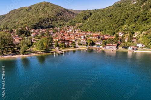 Aerial view of small village Brusimpiano located on the shore of lake Lugano, Italy