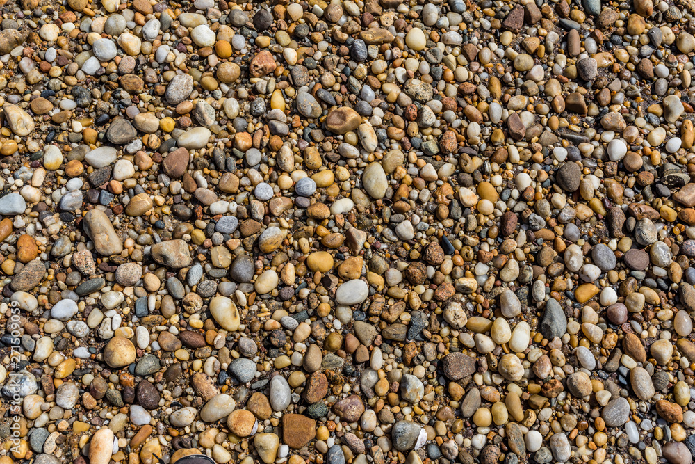 rocks obfuscating the sand on a sunny beach rocks obfuscating the sand on a sunny beach