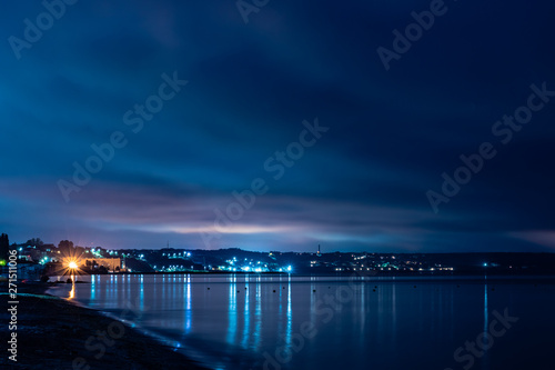 night city lights in the reflection on the beach © Spyrydon