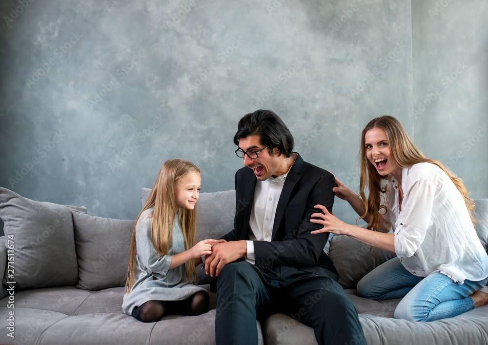 © alphaspirit - Happy little girl play with her mother and father © alphaspirit - Happy little girl play with her mother and father