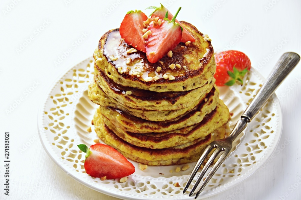 Paleo hazelnut pancakes with honey and strawberry. Gluten and sugar free pancakes
