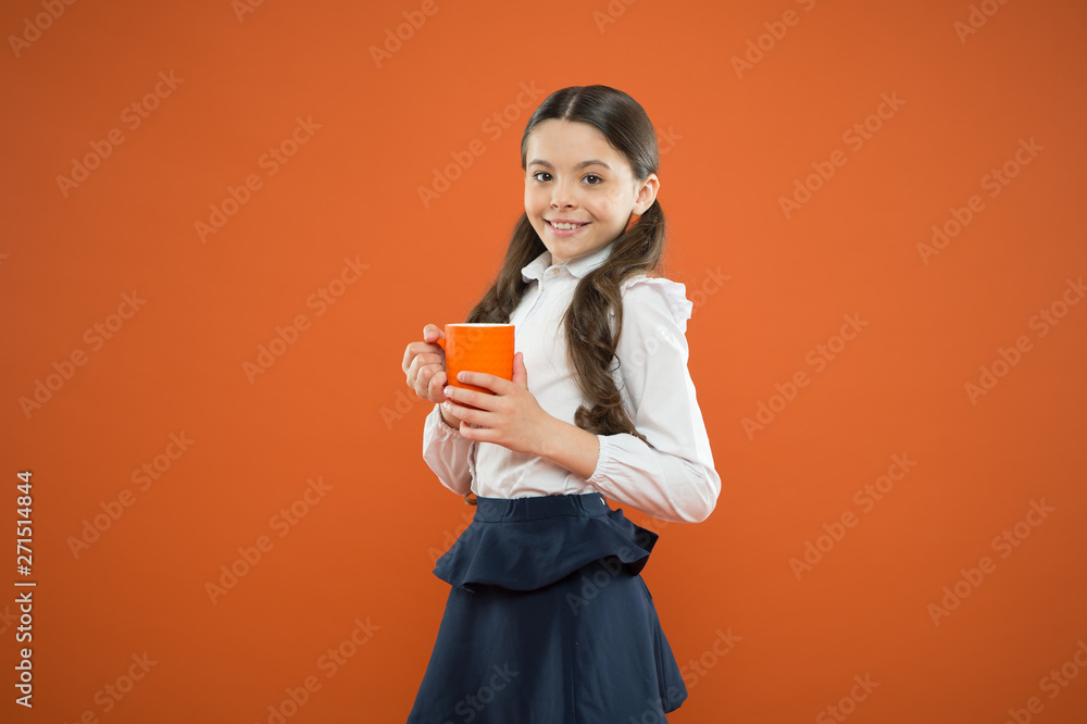 Water balance. Enjoying tea before school classes. Drink enough water. Inspiring drink. Girl drink cocoa or tea. Calories fuel for brain. Schoolgirl with mug having tea break. Relax and recharge Water balance. Enjoying tea before school classes. Drink enough water. Inspiring drink. Girl drink cocoa or tea. Calories fuel for brain. Schoolgirl with mug having tea break. Relax and recharge