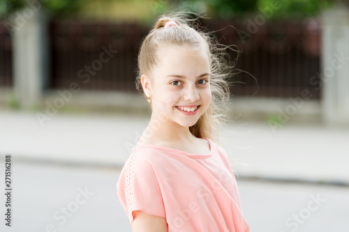 Having a very happy childhood. Happy little girl with big smile on summer day. Adorable small child with long blond hair and happy smile. Happy international childrens day