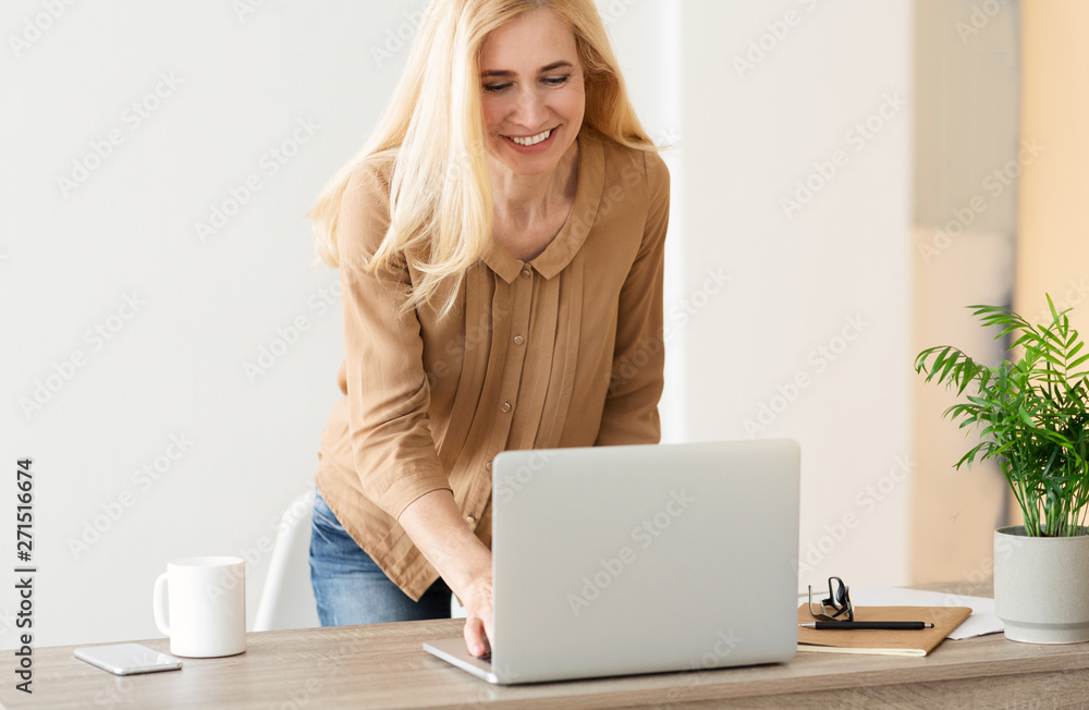 Responding On Business E-Mail. Woman Using Laptop Responding On Business E-Mail. Woman Using Laptop