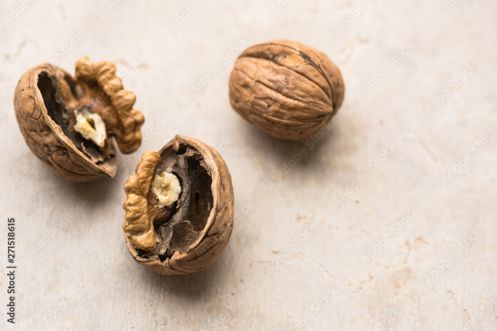 Delicious walnut on stone plate broken hard shell. Delicious walnut on stone plate broken hard shell.
