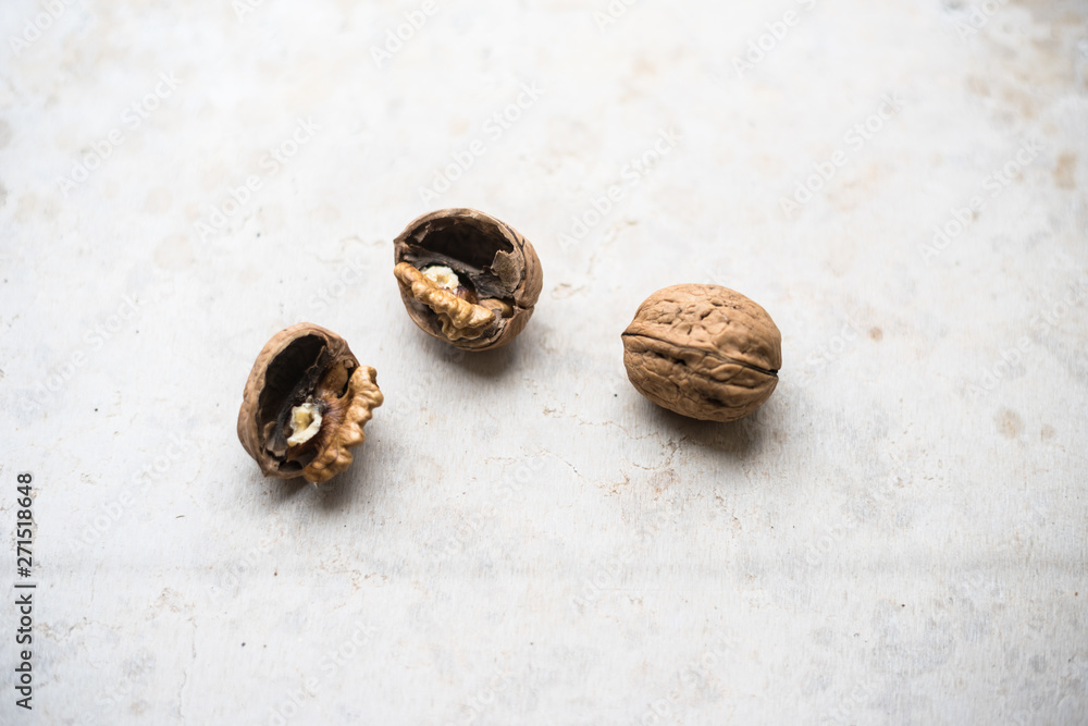 Delicious walnut on stone plate broken hard shell. Delicious walnut on stone plate broken hard shell.