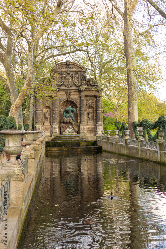 Paris, France - APRIL 9, 2019: Medici Fountain in the Luxembourg Garden, Paris
