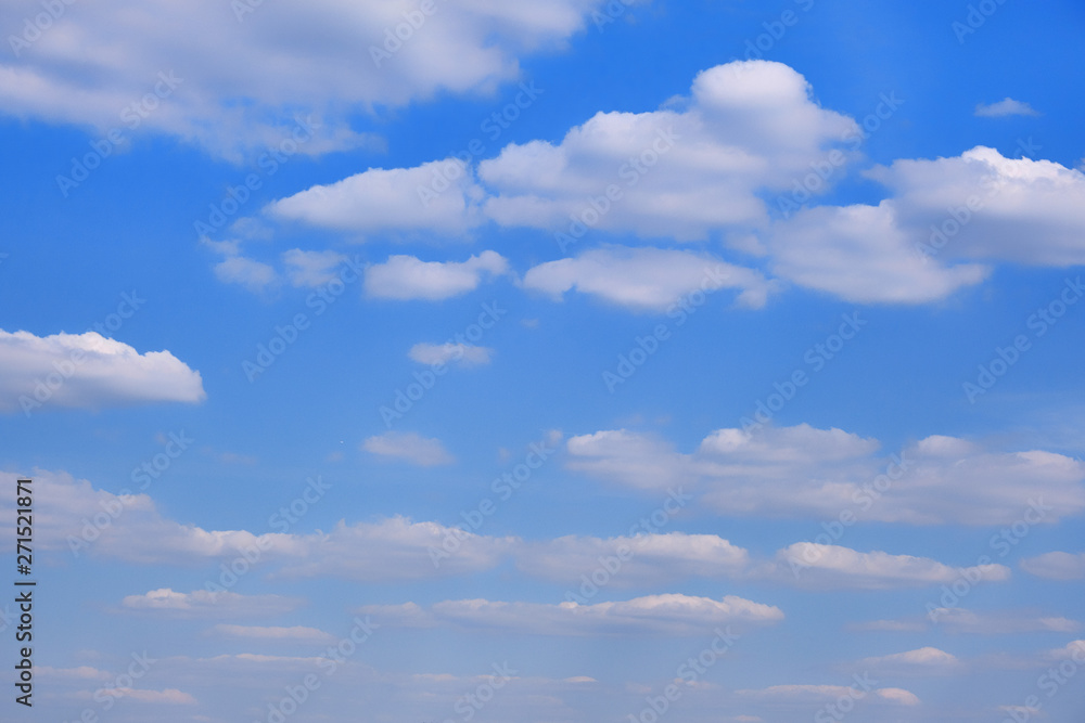 Cloudy sky in clear weather. Cumulus cloud on a sunny winter day. White clouds against a blue sky. Cloudy sky in clear weather. Cumulus cloud on a sunny winter day. White clouds against a blue sky.