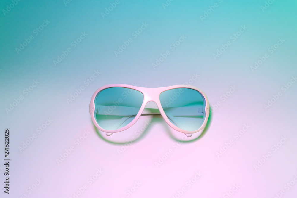 blue sunglasses on pastel color background. Creative fashion minimal concept blue sunglasses on pastel color background. Creative fashion minimal concept