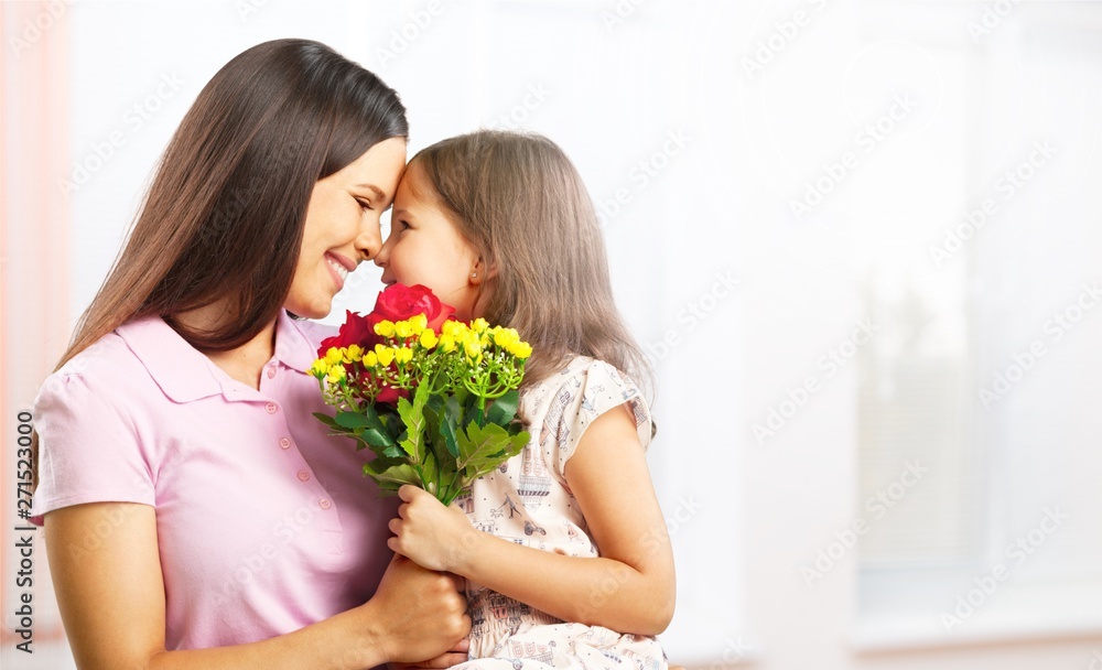 Portrait of happy mother and daughter holding Portrait of happy mother and daughter holding