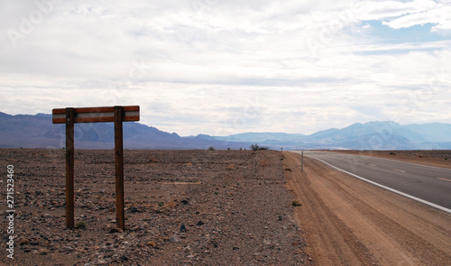 Road sign on a highway through the desert