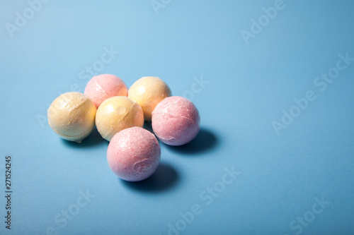 Triangle of pink and yellow bath bombs
