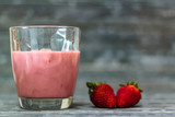 Glass with strawberry milkshake with copy space