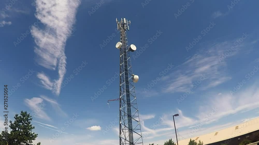 Cell Phone Communications Tower Against Blue Sky Cell Phone Communications Tower Against Blue Sky