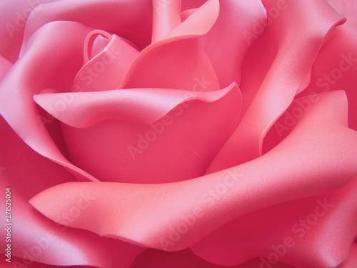 Background - Imitation of a rose flower. A closeup of a bud, petals.