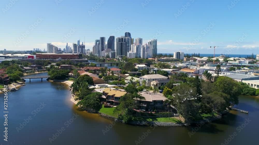 Luxurious Australian house on the water with Gold Coast skyscrapers in the background Luxurious Australian house on the water with Gold Coast skyscrapers in the background