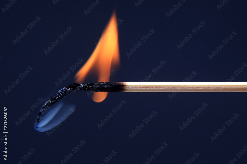 Fototapeta premium burning and Smoking wooden match on dark background.