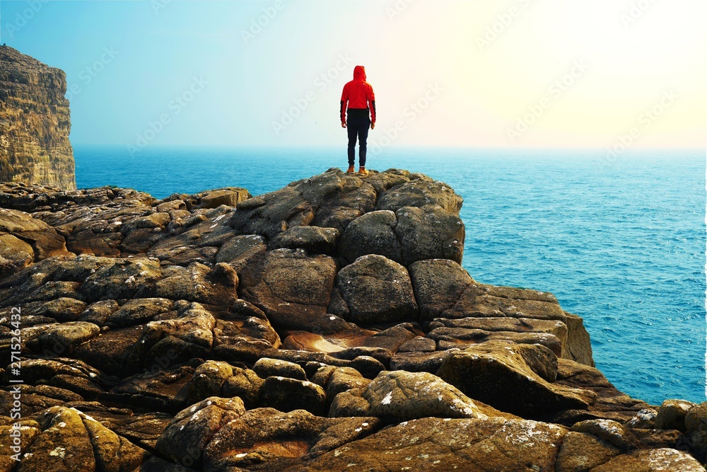Fototapeta premium man on a rock