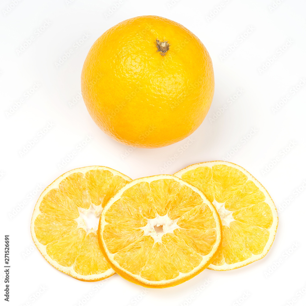 fresh orange and pieces of dried orange on white background
