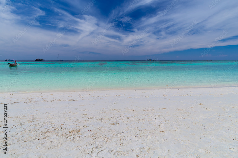 Clear water and blue sky at the paradise island in the tropical sea of Thailand