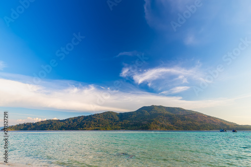 Clear water and blue sky at the paradise island in the tropical sea of Thailand