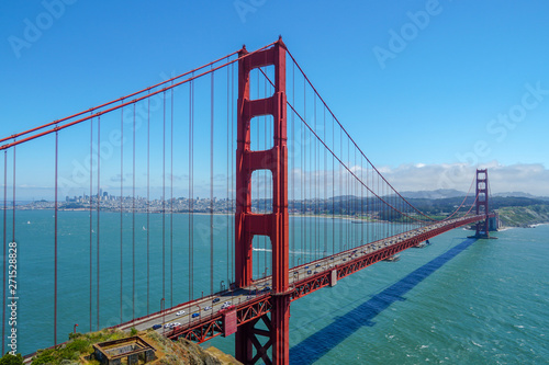 Famous Golden Gate Bridge. Suspension bridge spanning the Golden Gate. The structure links the American city of San Francisco, California, the northern tip of the San Francisco Peninsula to Marin C © Unwind