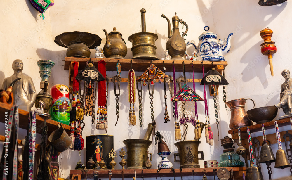 Old souvenirs and historical artifacts at a bazaar in the city of Bukhara