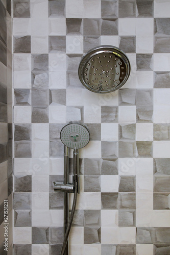 Modern shower head in bathroom with new home construction photo