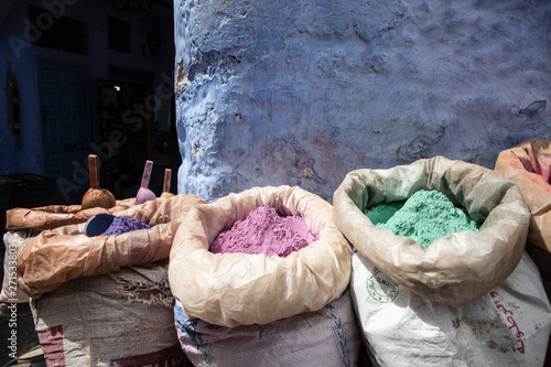 Multi colored dyes available in the street markets in Chefchaouen, Morocco © Marylou