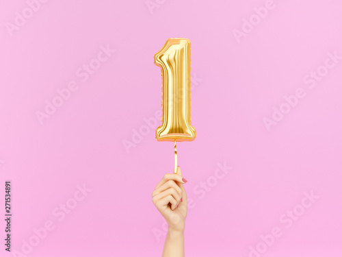 One year birthday. Female hand holding Number 1 foil balloon. One-year anniversary background. 3d rendering photo