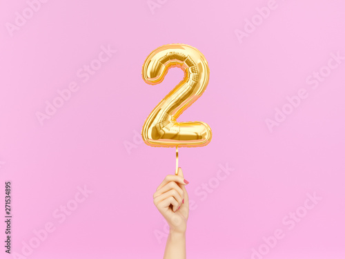 Two year birthday. Female hand holding Number 2 foil balloon. Two-year anniversary background. 3d rendering