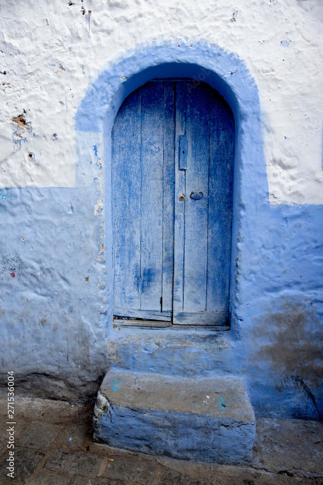 The blue doors of Chefchaouen, Morocco with their unique style The blue doors of Chefchaouen, Morocco with their unique style