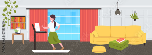 businesswoman using laptop running on treadmill woman freelancer workout hard working concept modern living room interior flat full length horizontal