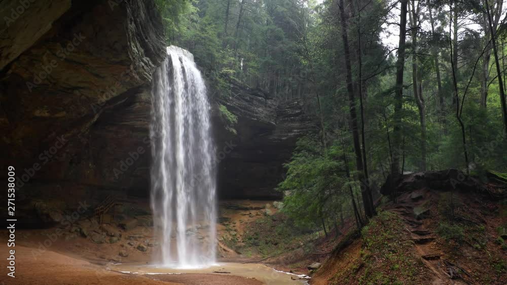Ash Cave Falls Loop - Ash Cave, an enormous recess cave in the Hocking Hills of Ohio, is graced by a plunging waterfall in this seamlessly looping footage.