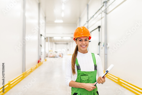 Portrait of a young female factory worker.