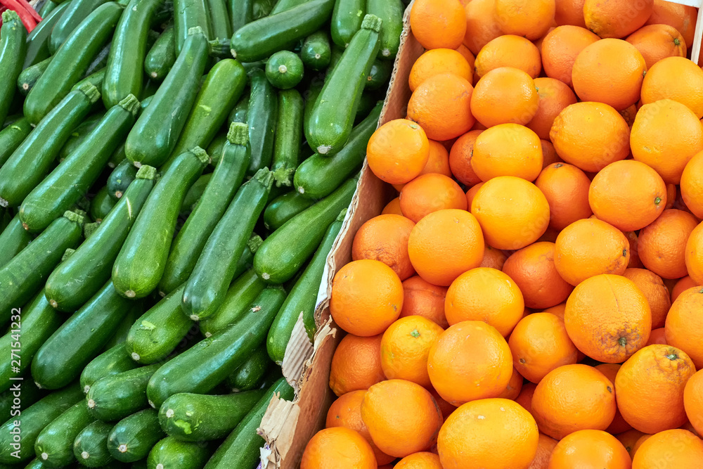 Oranges and gherkins for sale at a market