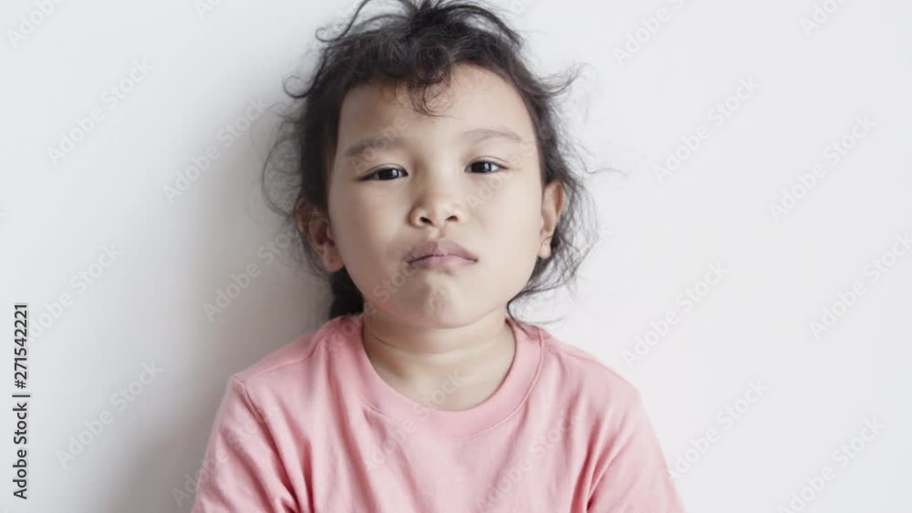 Asian girls sit and eat delicious snacks and happiness on white background Asian girls sit and eat delicious snacks and happiness on white background