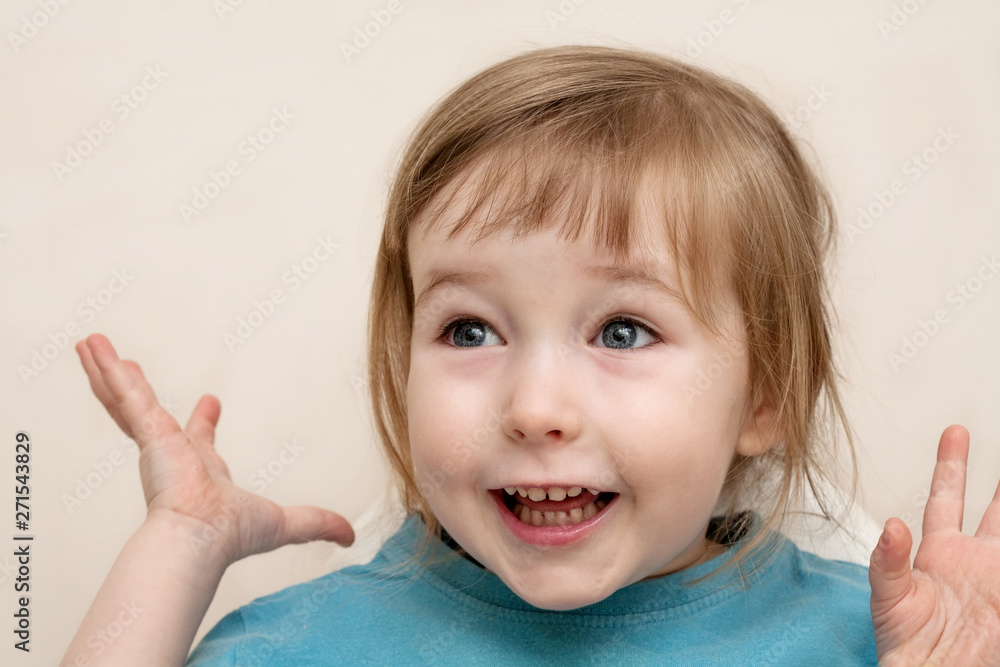 funny admiration emotional white child girl face closeup on beige wall background funny admiration emotional white child girl face closeup on beige wall background