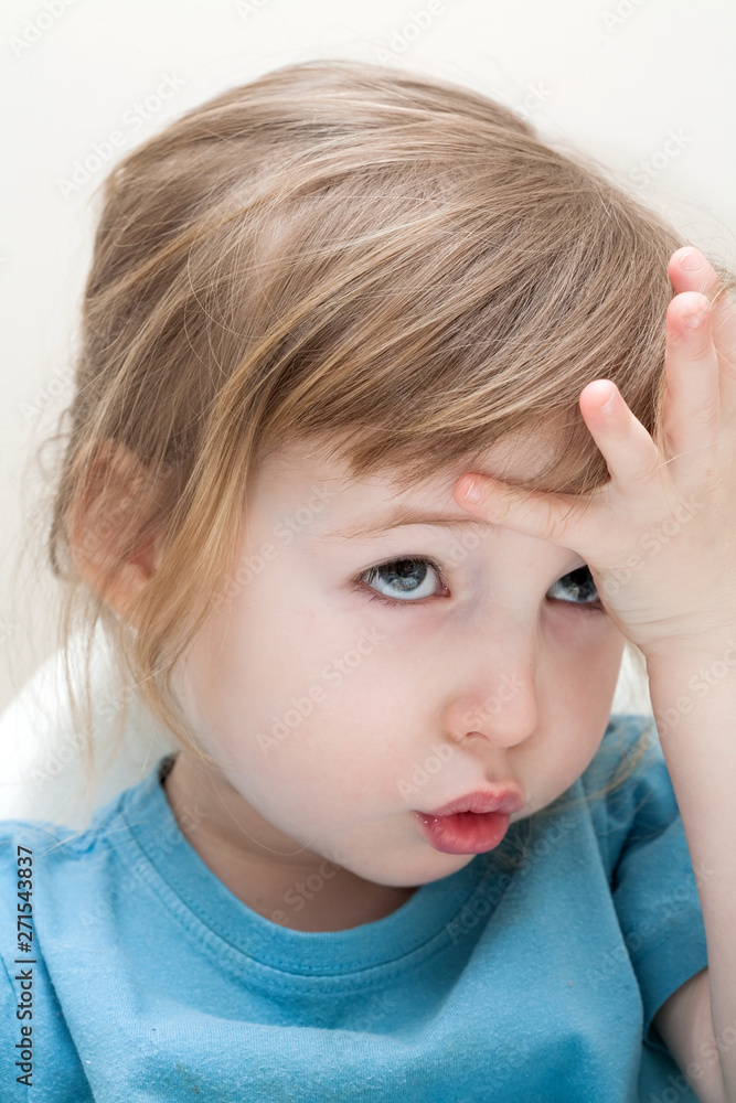 pensive emotional white child girl face closeup pensive emotional white child girl face closeup