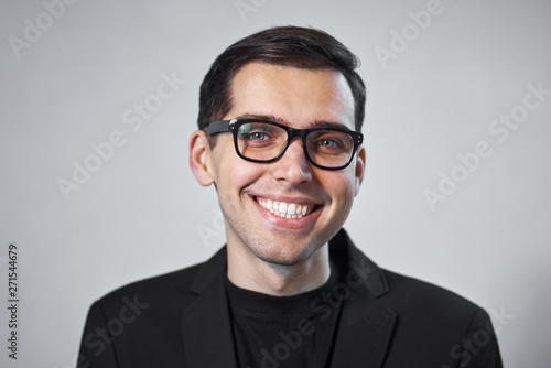 portrait of young man in glasses