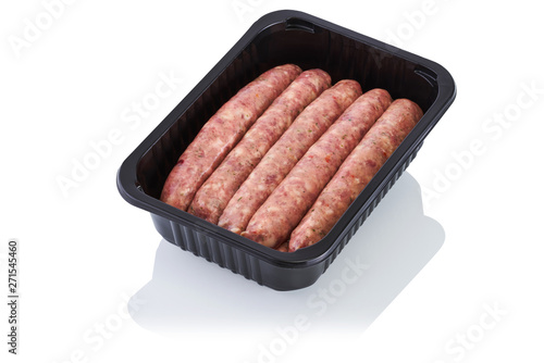 Plastic container with raw sausages isolated on white