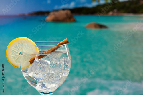 close-up gin tonic  with cinnamon on the beach