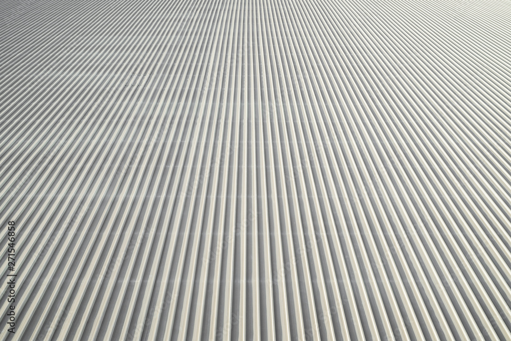 White gray roofing over a large area roof outdoor weather daylight for background graphic. White gray roofing over a large area roof outdoor weather daylight for background graphic.