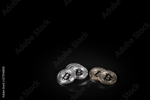 Bitcoin on black background with reflection. © Boris