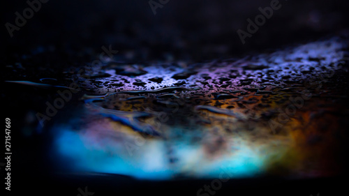 Dark background. Spilled li...