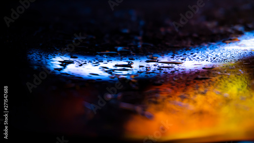 Dark background. Spilled li...