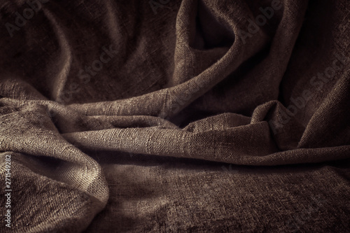 Coarse brown fabric. Vintage, rustic motifs. Background texture, free space, pattern.