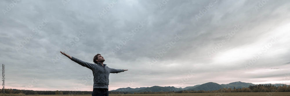 Wide view image of young man celebrating life Wide view image of young man celebrating life